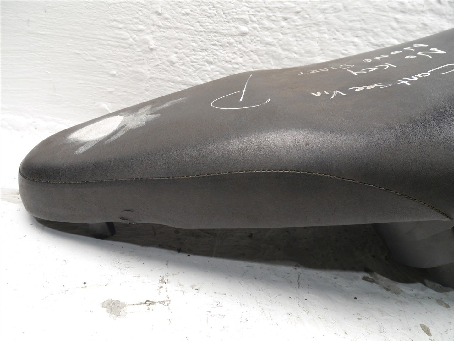HONDA NSC110 VISION 2012-2016 SEAT AND STORAGE TUB (TORN)
