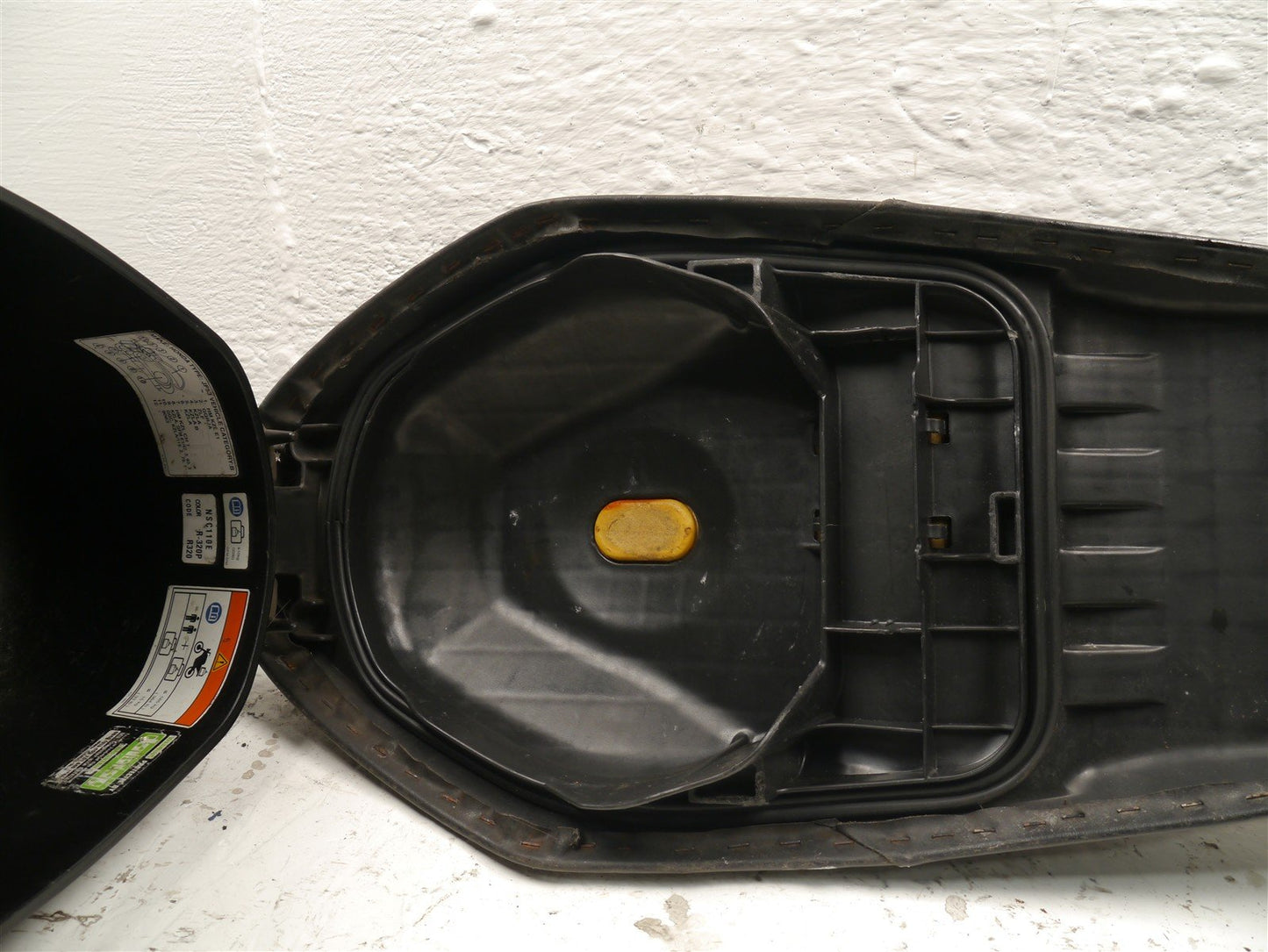 HONDA NSC110 VISION 2012-2016 SEAT AND STORAGE TUB (TORN)