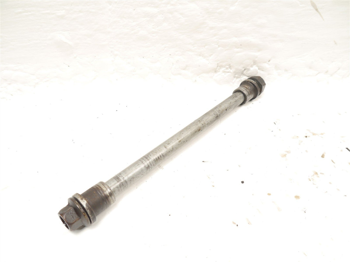 HONDA FES 125 S-WING FRONT WHEEL SPINDLE