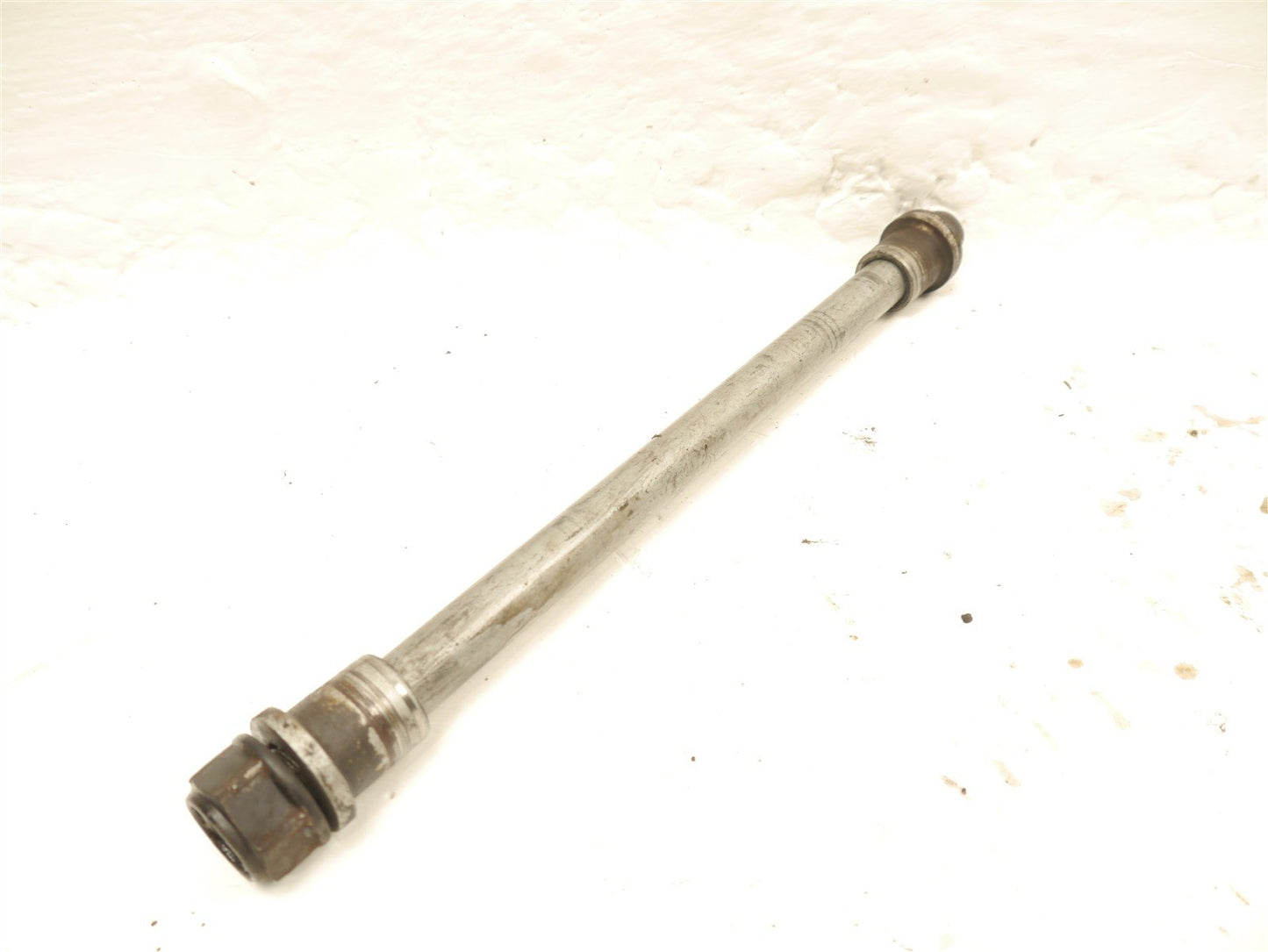HONDA FES 125 S-WING FRONT WHEEL SPINDLE